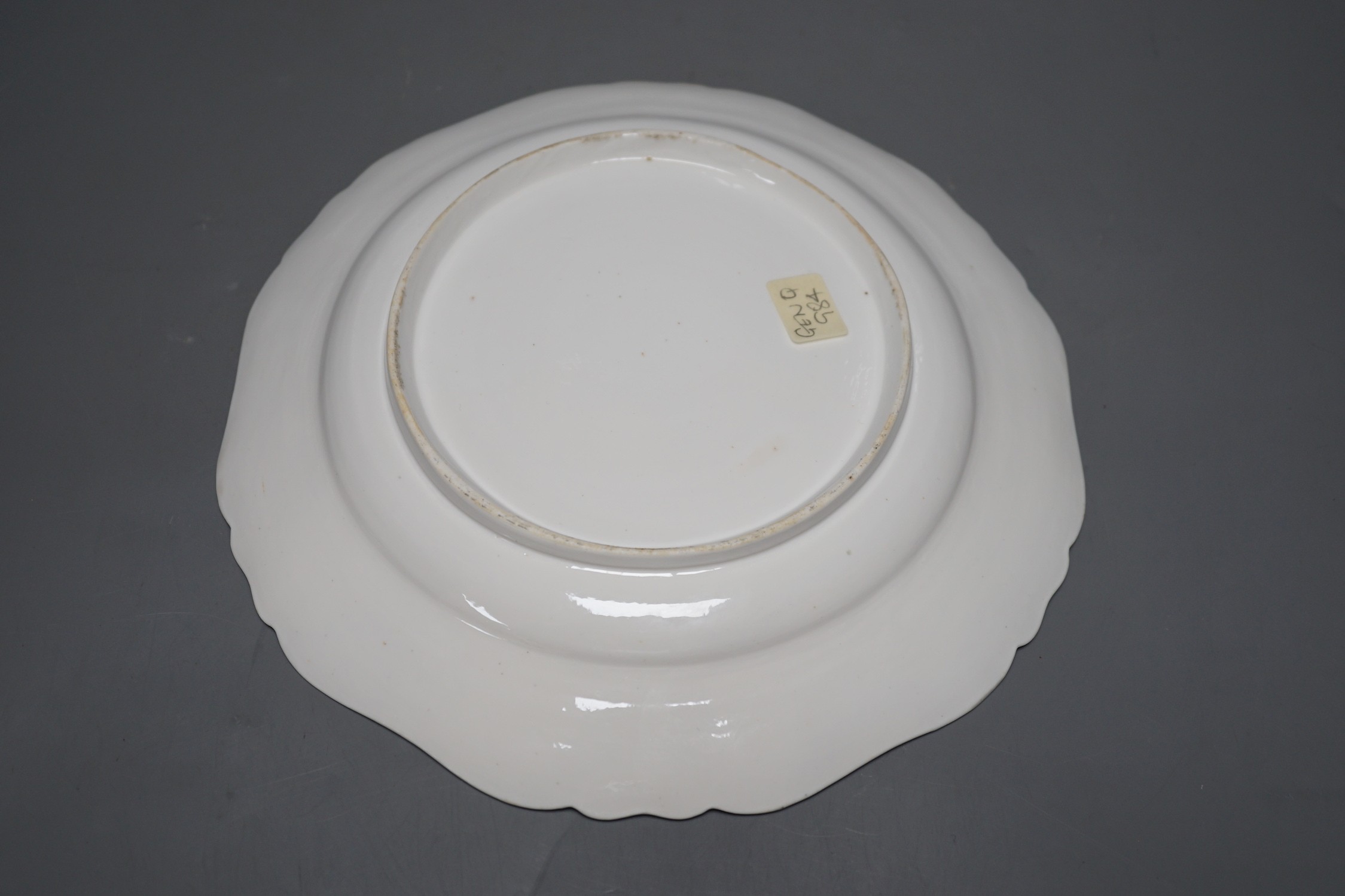 Seventeen late 18th century Continental porcelain rose painted plates 24cm